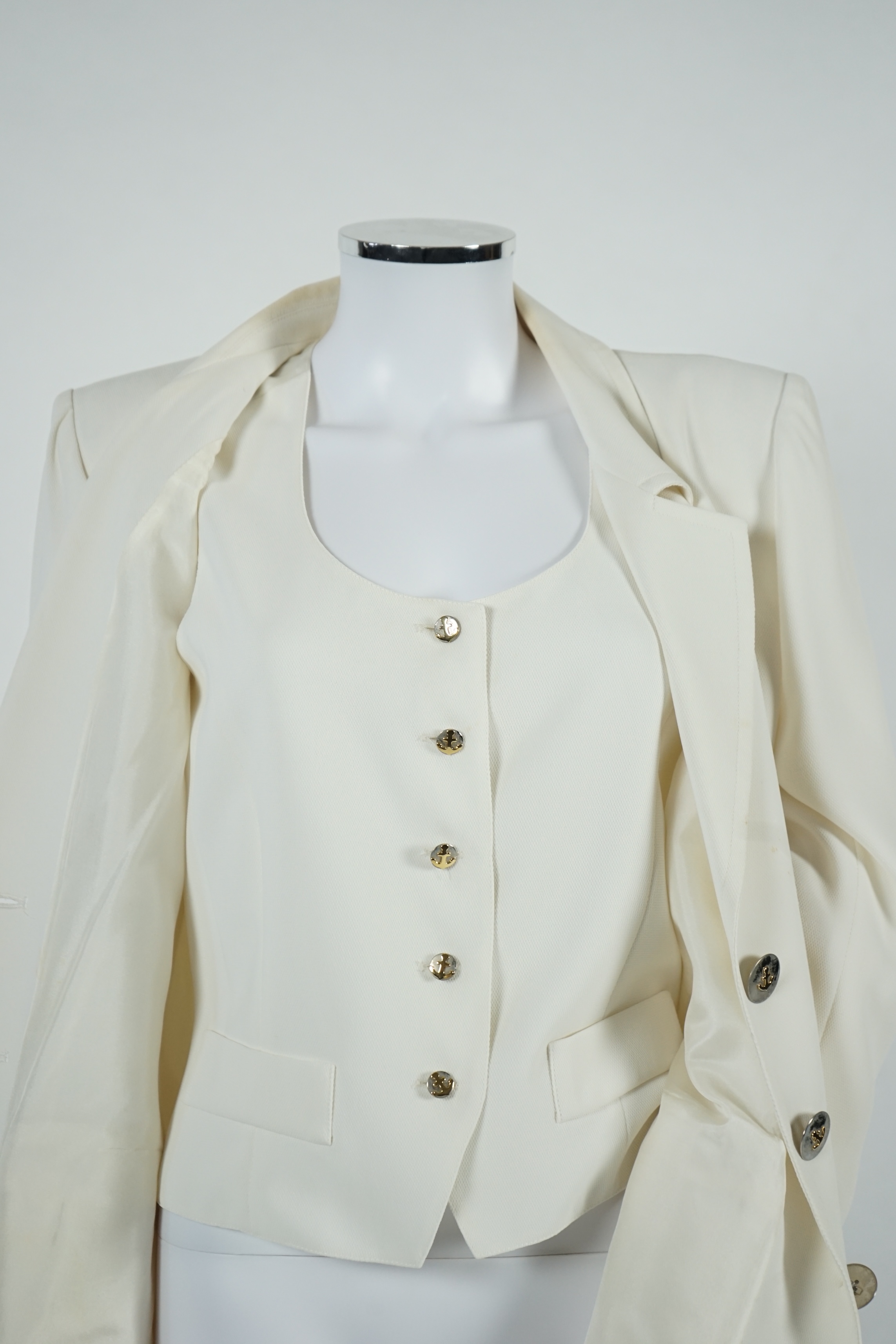 A vintage Yves Saint Laurent variation lady's off white three piece trouser suit with skirt (four pieces), F 40 (UK 12). Proceeds to Happy Paws Puppy Rescue